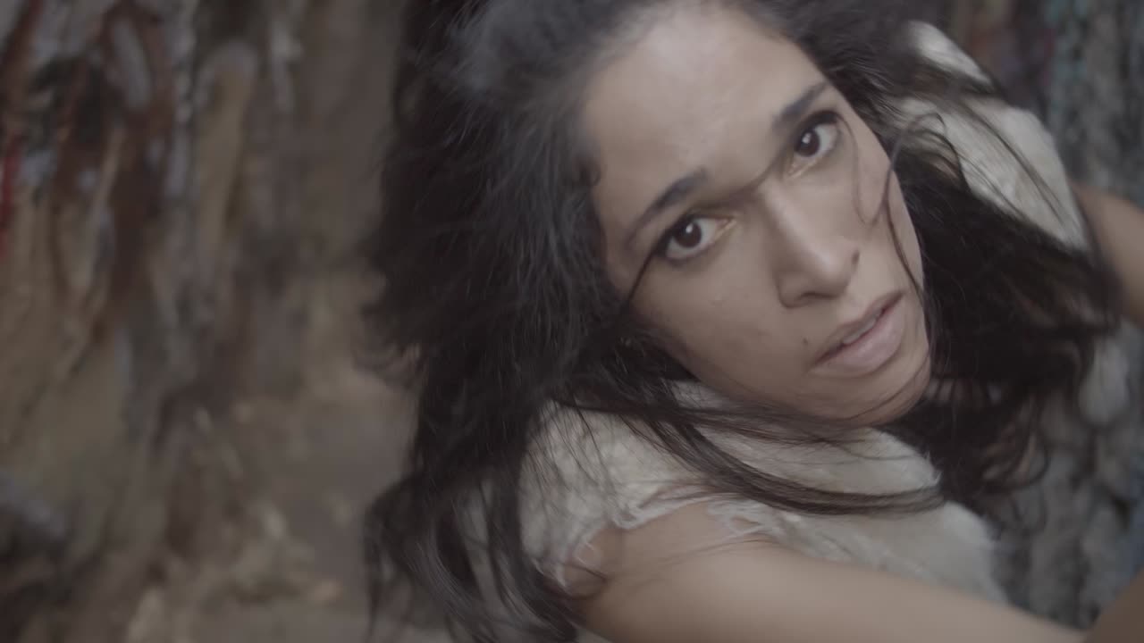 Woman trapped in a spinning pit. View from above. Real time.