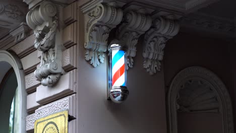 Barber-spinning-colorful-sign-old-town.-Vilnius