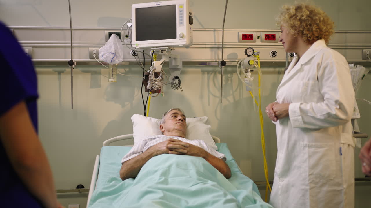Patient in hospital bed with doctor