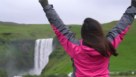 traveler travel to skogafoss waterfall in iceland.