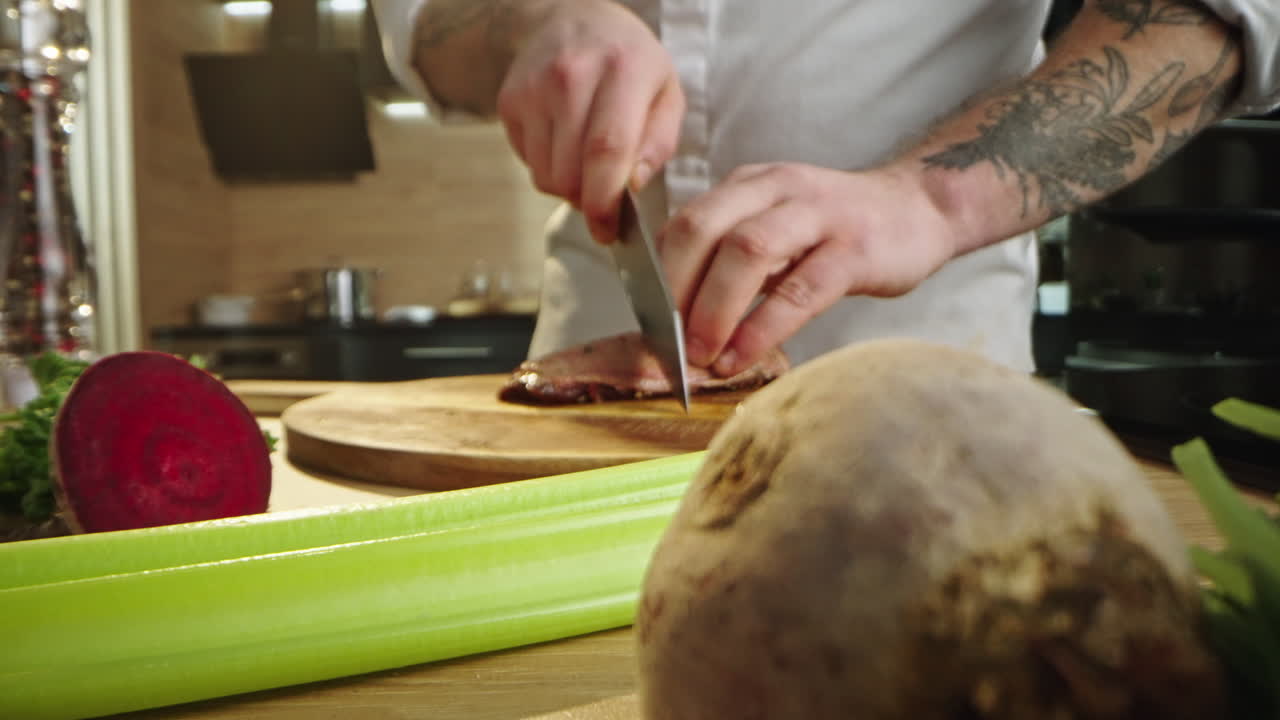Chef preparing duck breast in the kitchen