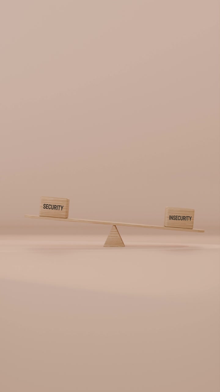 VERITCAL VIDEO OF SECURITY AND INSECURITY BALANCING ON SEESAW
