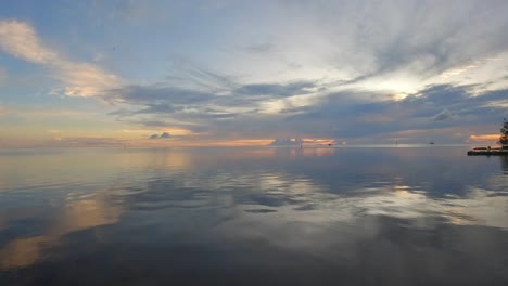 Beach-View-at-Sunset-in-Tahiti,-French-Polynesia-~-Slow-Pan-of-the-Pacific-Ocean-from-Paea