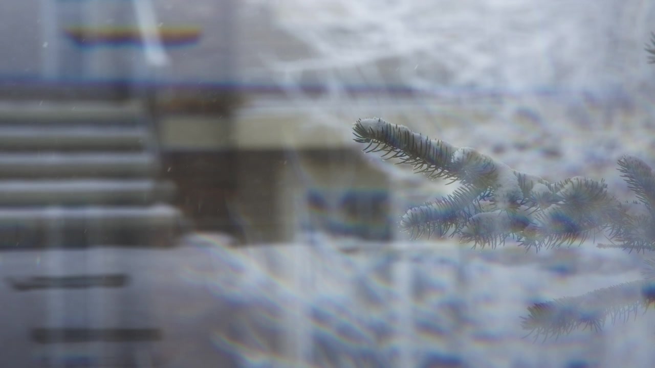 Abstract prism window view of the snowfall outside the house in winter