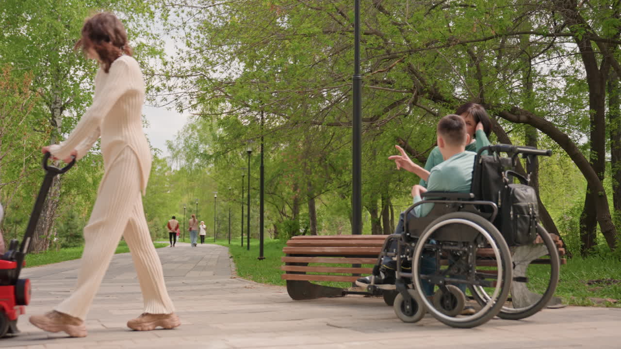 Caregivers And Children In Park, Young Man And Toddler At Park Together, Children And Caregivers Share Relaxed Moment Outdoors, Family Spends Peaceful Day At Park With Young Man And Toddler