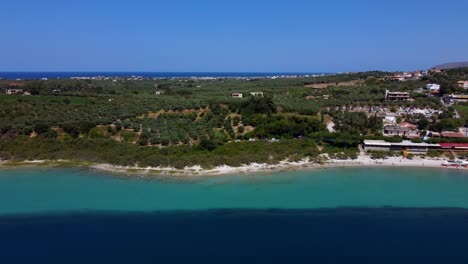 kournas natural freshwater lake and surrounding vegetation, drone shot