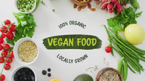 100 percent organic vegan food locally grown text animation over fresh vegetables and grains