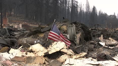 american flag left standing after disaster