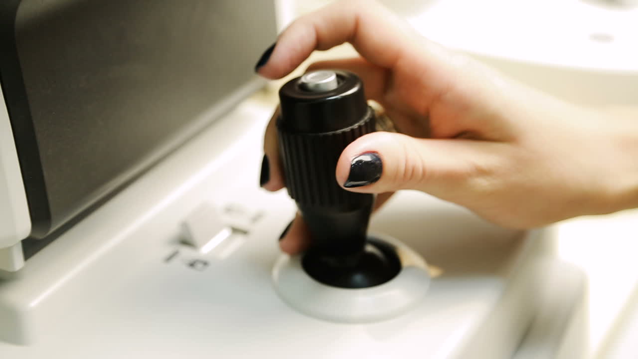 Modern medical equipment. Close up of hand working on modern medical equipment in operating room