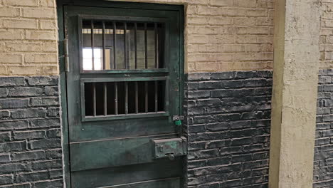 old abandoned spooky prison cells with locked doors