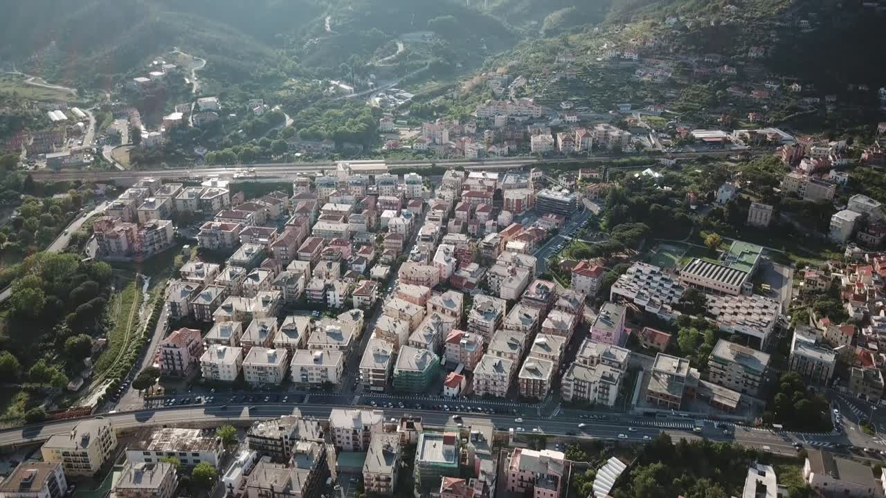Top view of an italian city during a sunset, mountains behind. genoa, Italy