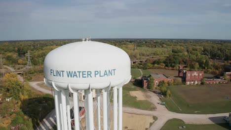 flint, michigan water tower close up drone video moving sideways