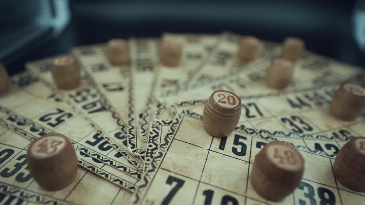 Crane fpv rotating shot of a Bingo desk lottery game, vintage cards with numbers, wooden chips, super slow motion 120 fps, studio lights
