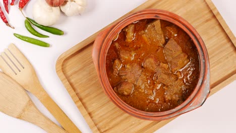 traditional indian curry lamb masala in a bowl on table