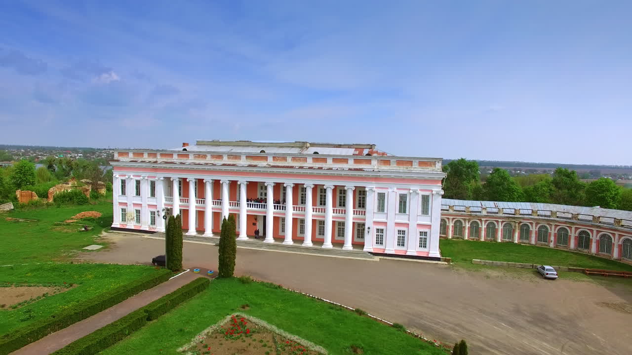 Group of tourists standing on the second floor of the palace in Tulchyn, Vinnytsia region, Ukraine. Drone footage rising above the historical ensemble.
