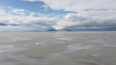 Low-ground-aerial-flyover-over-the-Great-Salt-Lake,-Utah-on-a-sunny-spring-day