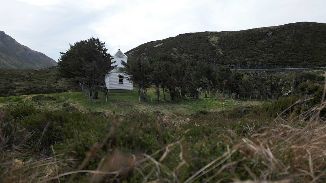 Windswept Trees Surrounding Graveyard on the Norwegian Coastline, close to M&aring;l&oslash;y in Vestland