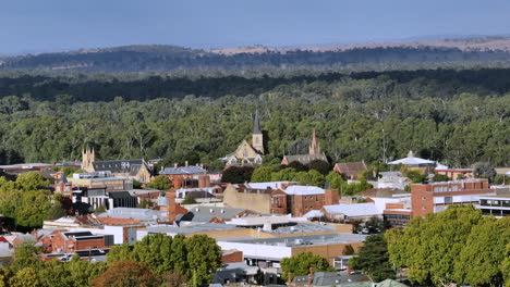 aerial: drone shot of churches and buildings in wagga wagga, nsw australia