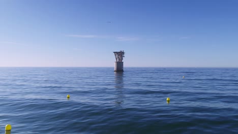 fixed shot of abandoned cable tower in playa del cable, marbella, spain