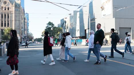 people crossing a street in melbourne, australia