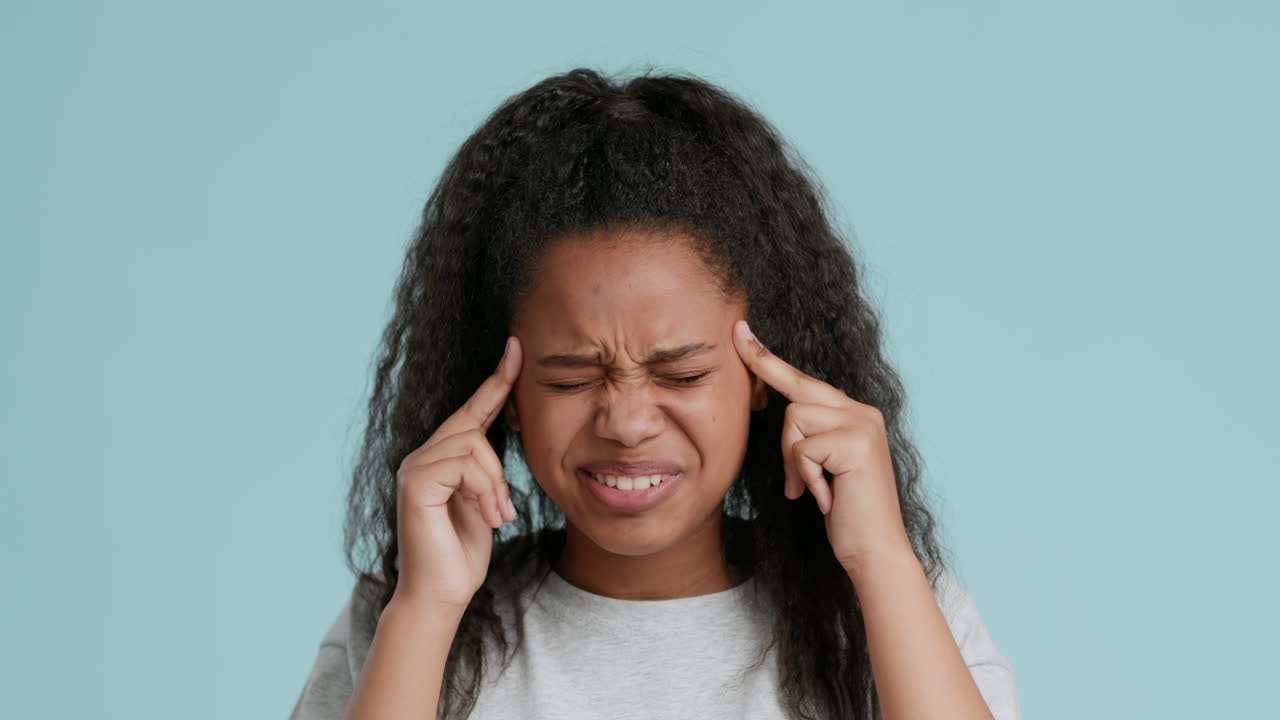 Teenage Girl Experiencing Headache