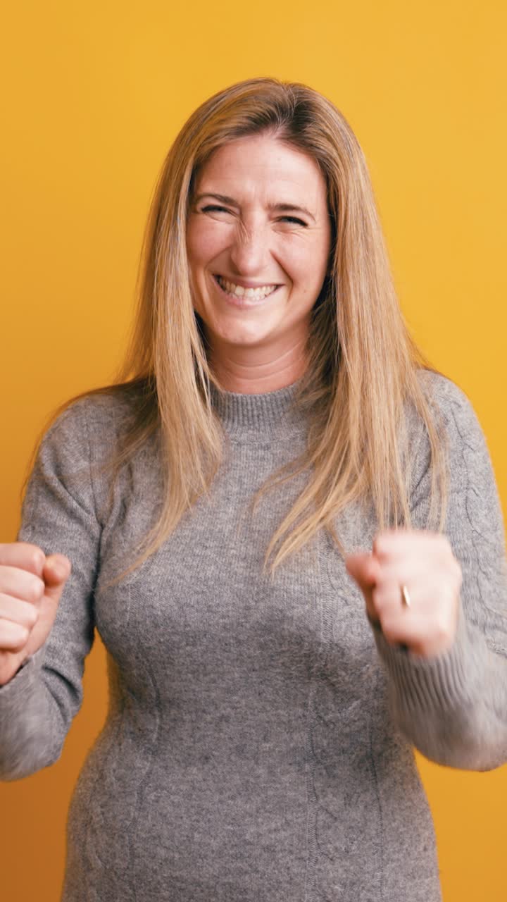 Joyful Woman Celebrating Success with Happy Expressions