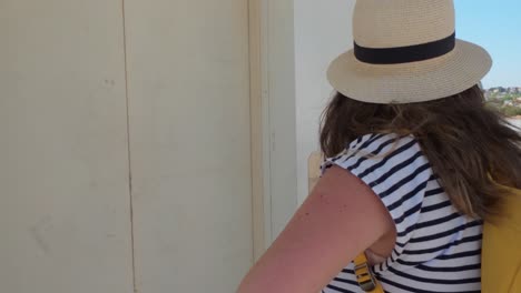 female tourist standing near elevator door