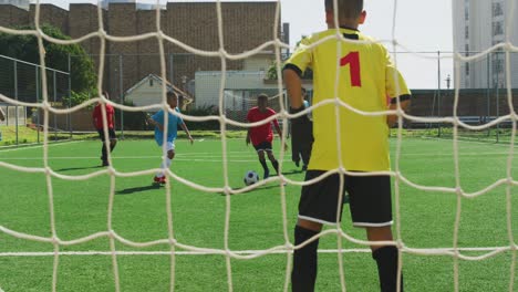 soccer kids playing in a sunny day