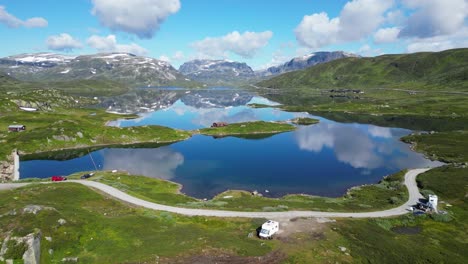 RV-Camper-Motorhomes-at-the-water-in-Norway---Stavatn-Lake,-Vestland,-Vestfold-og-Telemark---Aerial-Circling