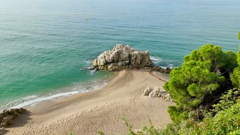 beautiful paradise beach in the mediterranean costa del maresme barcelona aerial view turquoise blue water with natural rocks