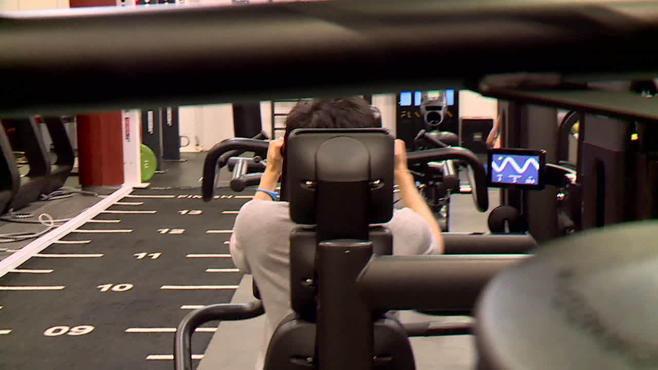 Man working out on exercise machine in gym