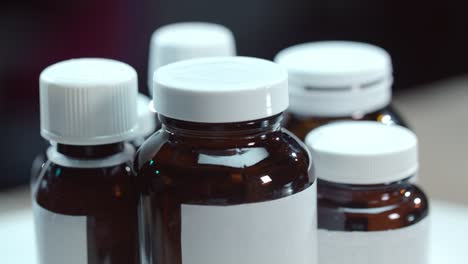 medical bottles rotating on table. pharmacy bottles. pharmaceutical industry