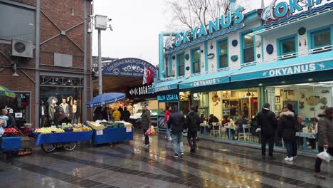 istanbul fish market and restaurant scene on a rainy day