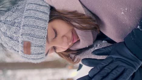 little girl trying to stay warm at obersee switzerland vertical video