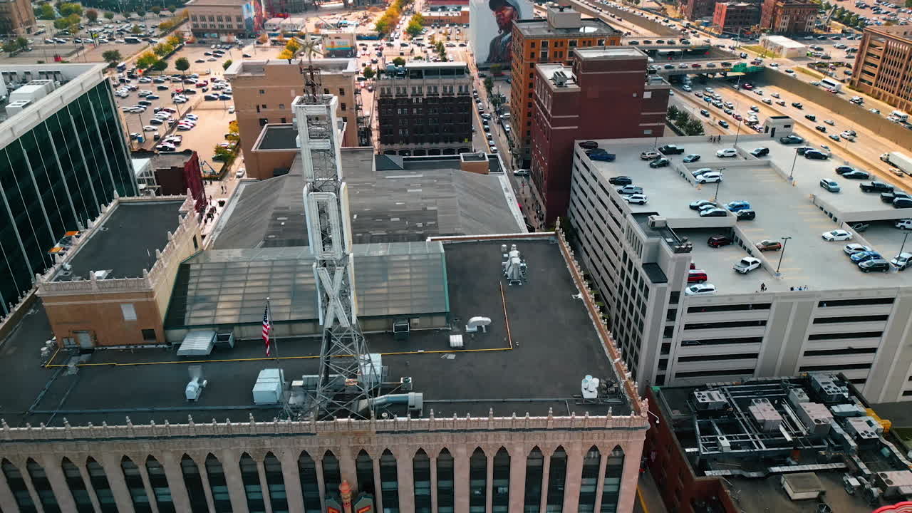 Detroit, USA, 28 July 2025: Tower on the rooftop of Fox Theatre in Detroit, Michigan, USA. Scenery of the city with multiple cars at backdrop