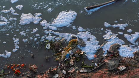 dirty spoiled riverbanks of ganga in varanasi, india - close up