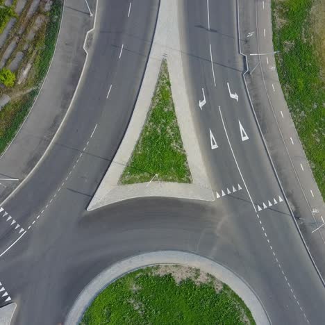 city traffic at roundabout. flying above huge roundabout full of cars and trucks at rush hour