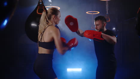 woman and man boxing training session
