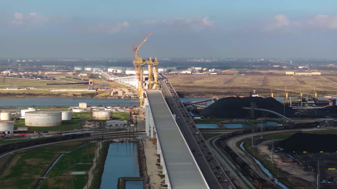 Aerial view rotating away from the Beltway 8 bridge, golden hour in Houston, USA