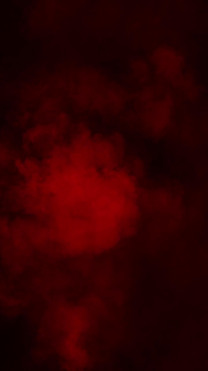 Formato verticale, fumo o nebbia rosso vivo che si espande su sfondo nero per un'atmosfera intensa, loop continuo