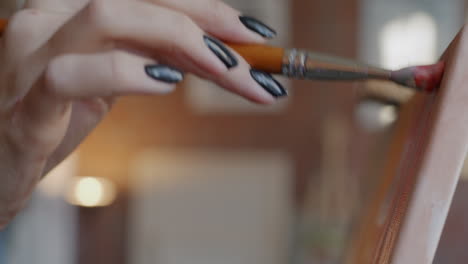 woman painting a canvas