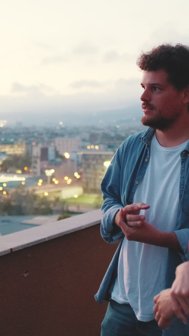Man on a rooftop at sunset