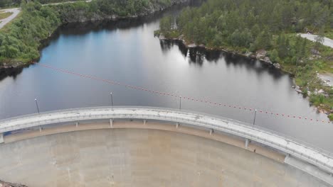 pullback reveal of hydro dam sarvsfossen on river otra in bykle, norway