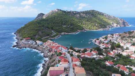 coastal village in greece with red roofs