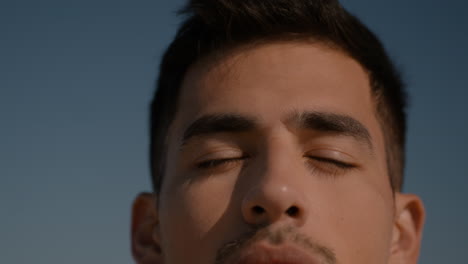 young man posing on sunny day