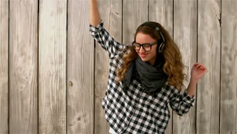 pretty girl listening to music and dancing