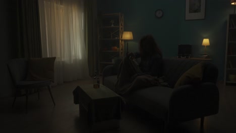 woman drinking alone at home