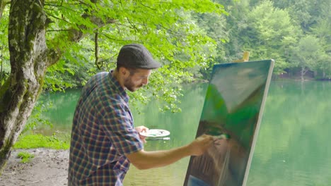 Painter painting in the forest.
