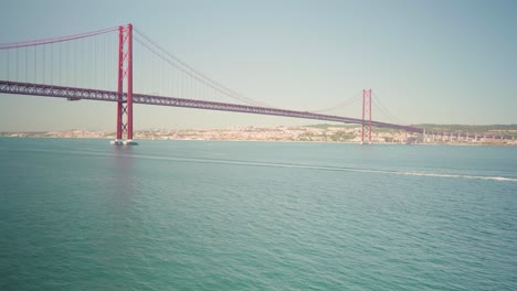 Abandoned-viewpoint-reveals-big-river-with-boat-and-big-bridge-through-window