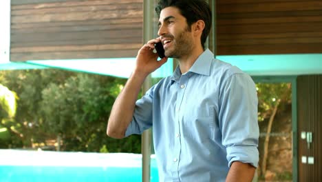 Smiling-businessman-having-a-phone-call